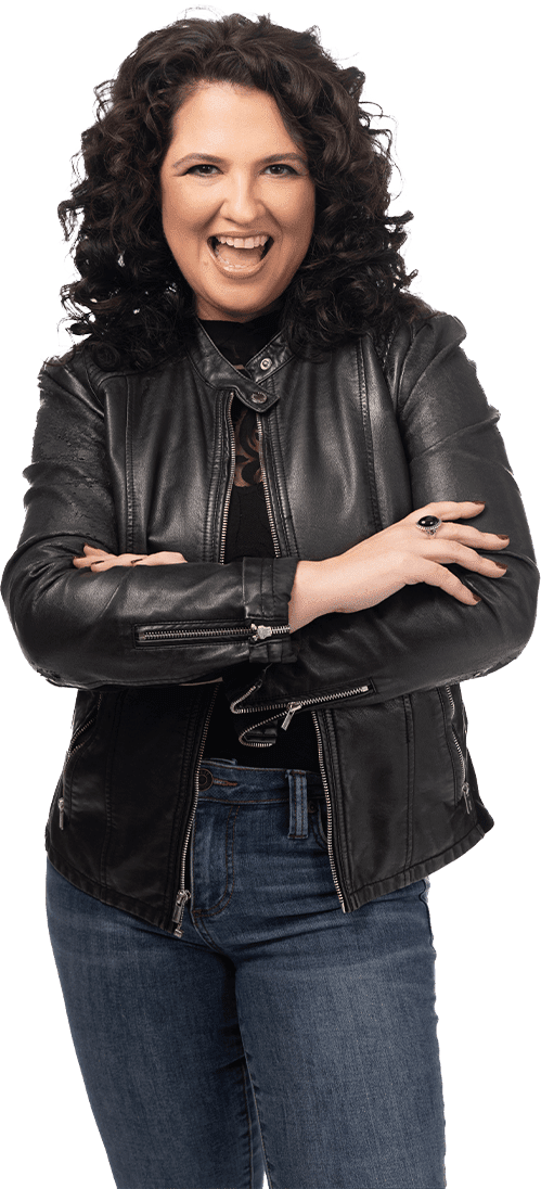 A woman in black leather jacket with arms crossed.