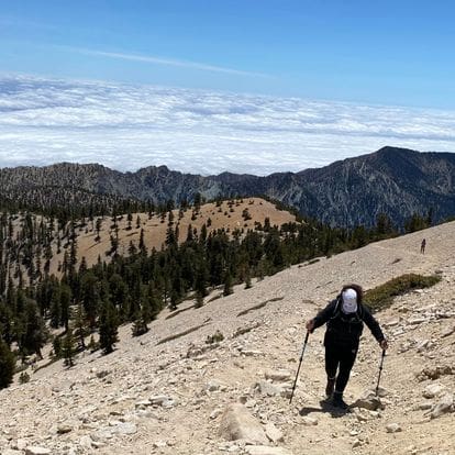 A person hiking up the side of a mountain